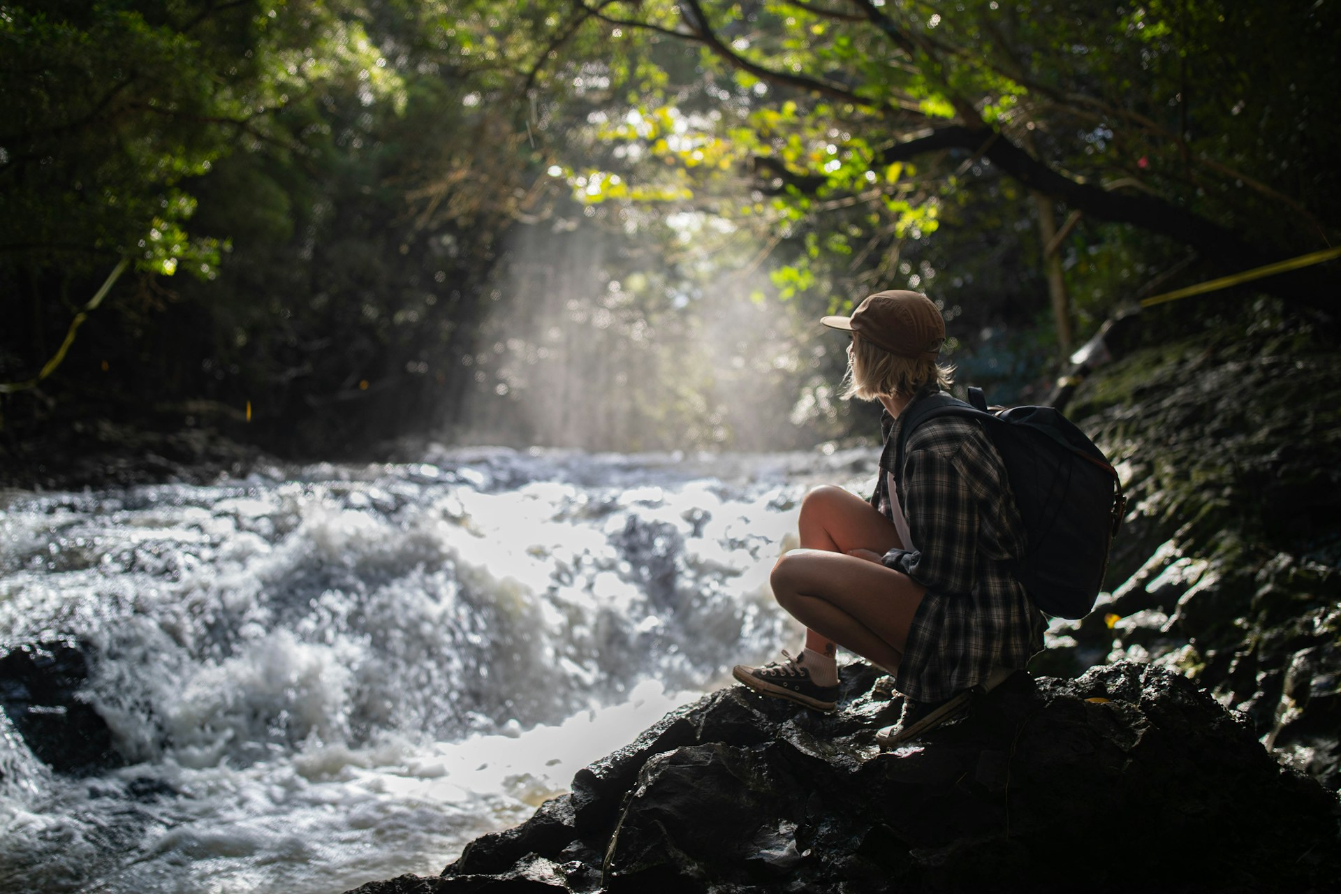 Tourist watching the flowing of a river 